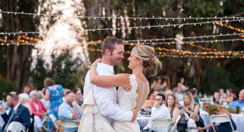 wedding timeline bride with twinkle lights in background